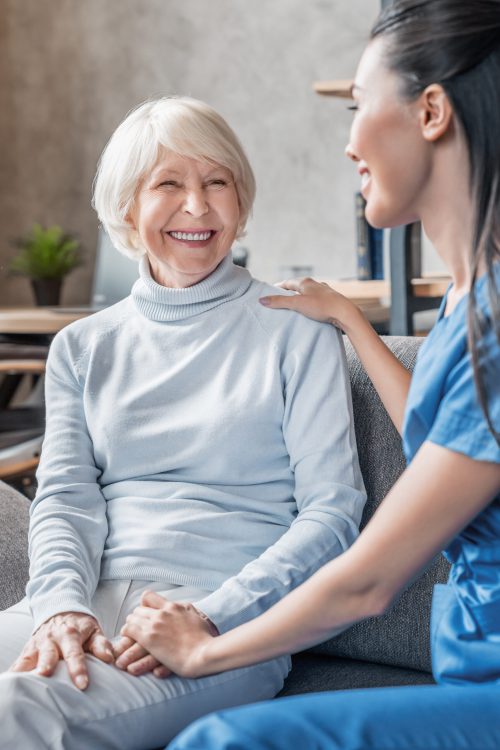 Vertical shot of helpful nurse taking care of senior woman in nursing home Senior Adult, Nurse, Patient, Care, Assistance